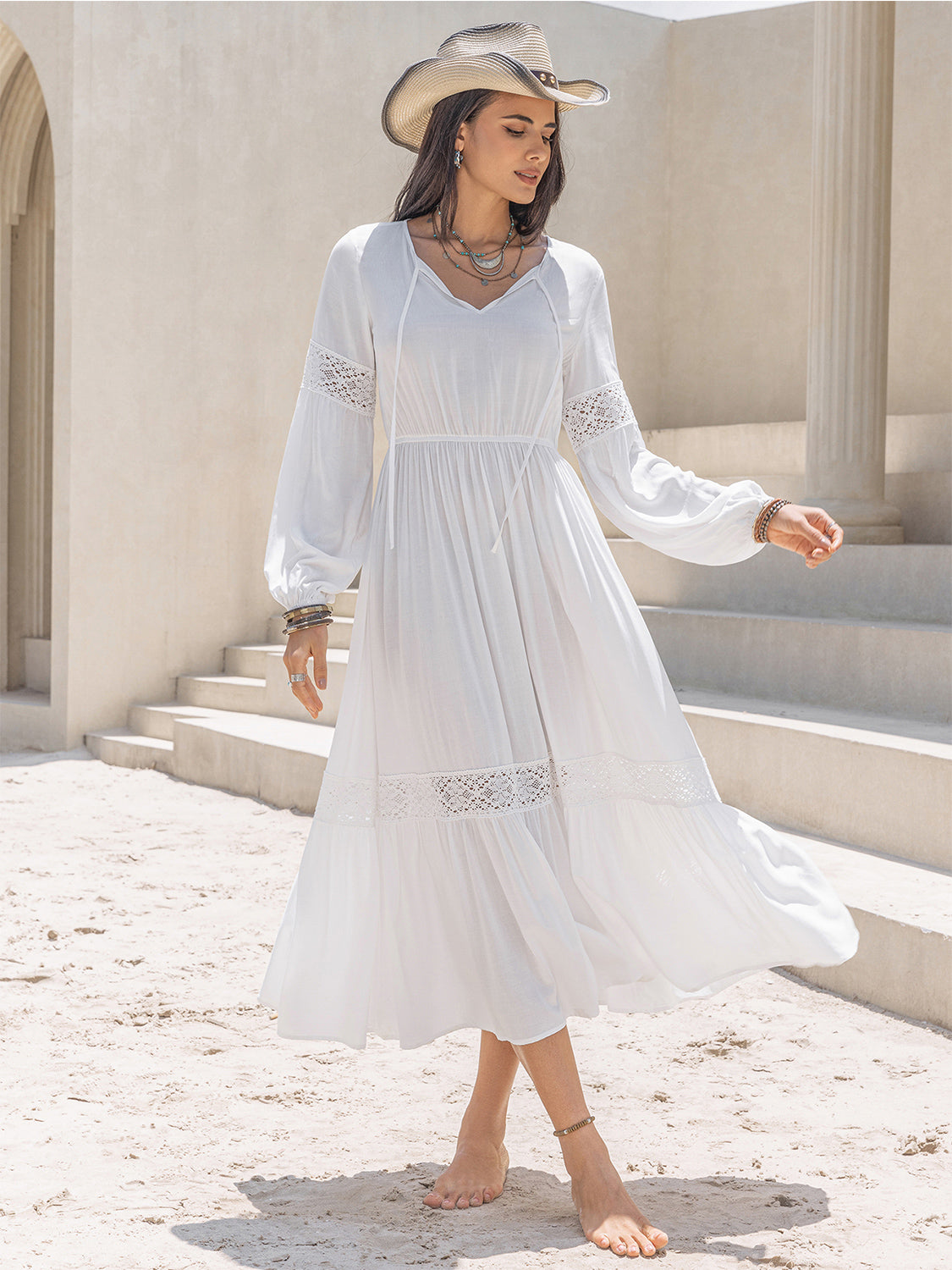 Vestido midi con mangas globo y cuello anudado