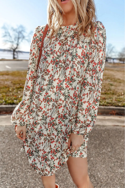 Vestido mini de manga larga con cuello redondo y estampado floral