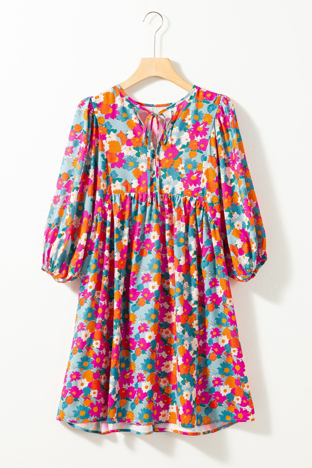 Vestido mini con mangas abullonadas y cuello con lazo floral