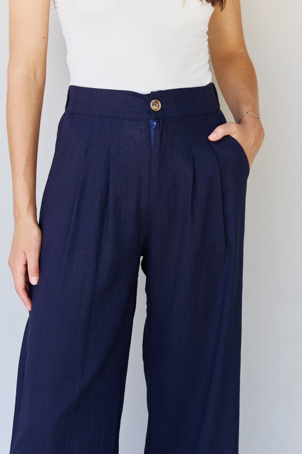 And The Why In The Mix Full Size Pleated Detail Linen Pants in Dark Navy - Runway Regalia