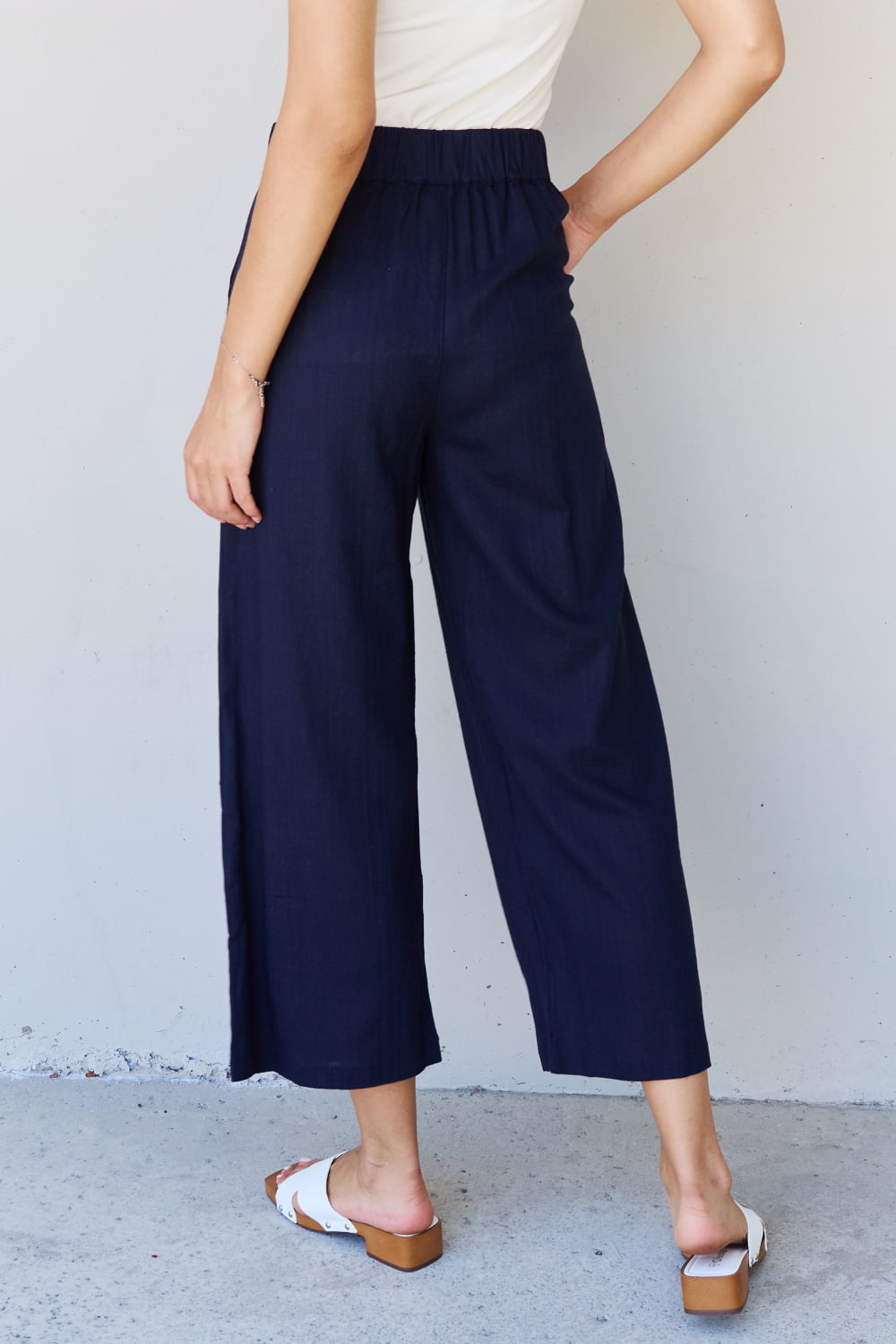 And The Why In The Mix Full Size Pleated Detail Linen Pants in Dark Navy - Runway Regalia